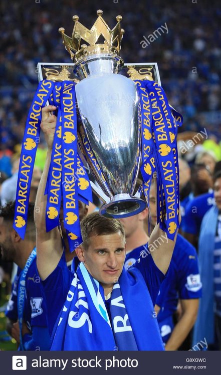 leicester-citys-marc-albrighton-lifts-the-trophy-as-the-team-celebrate-G8XGWC.jpg